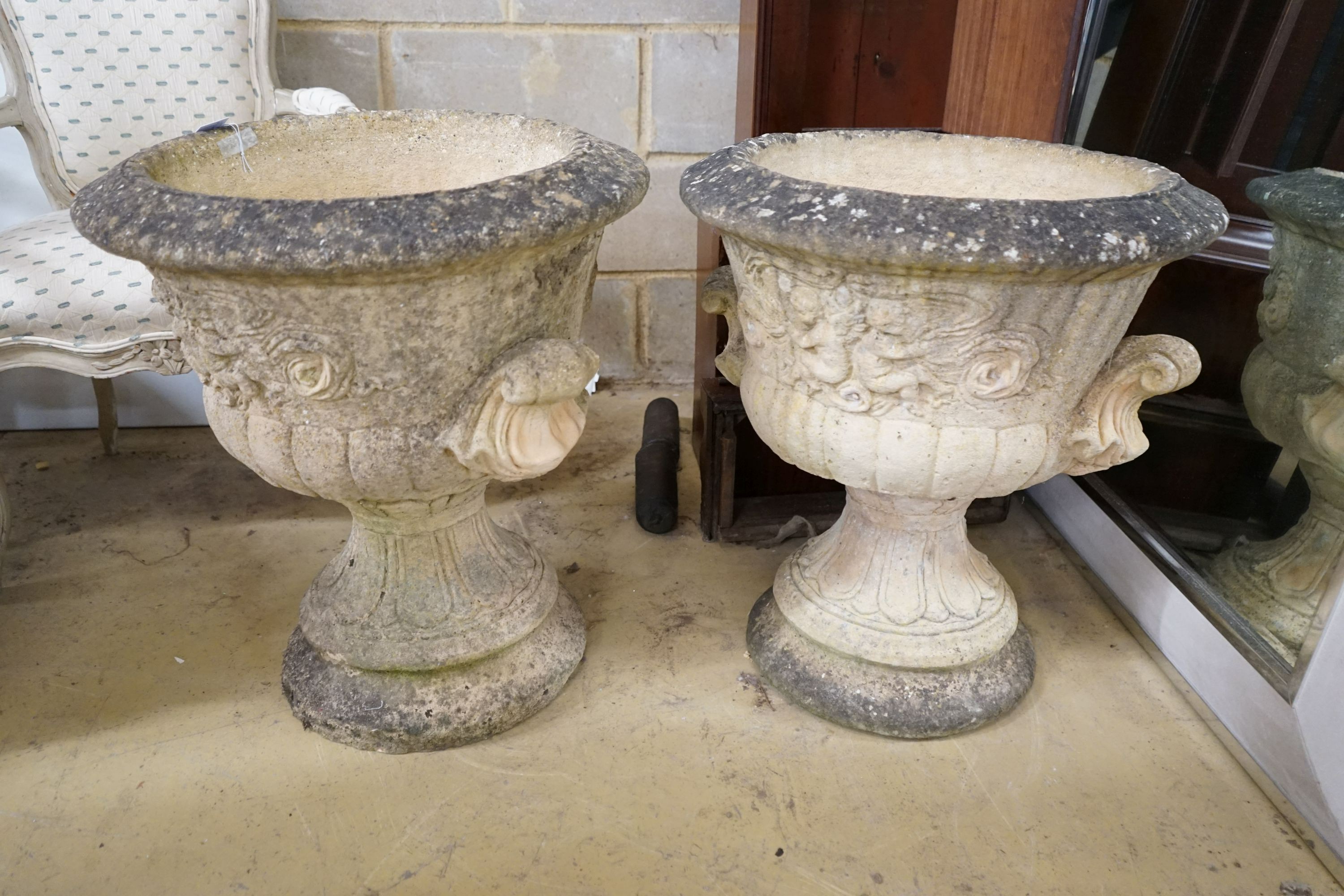A pair of large circular reconstituted stone garden planters, diameter 56cm, height 63cm